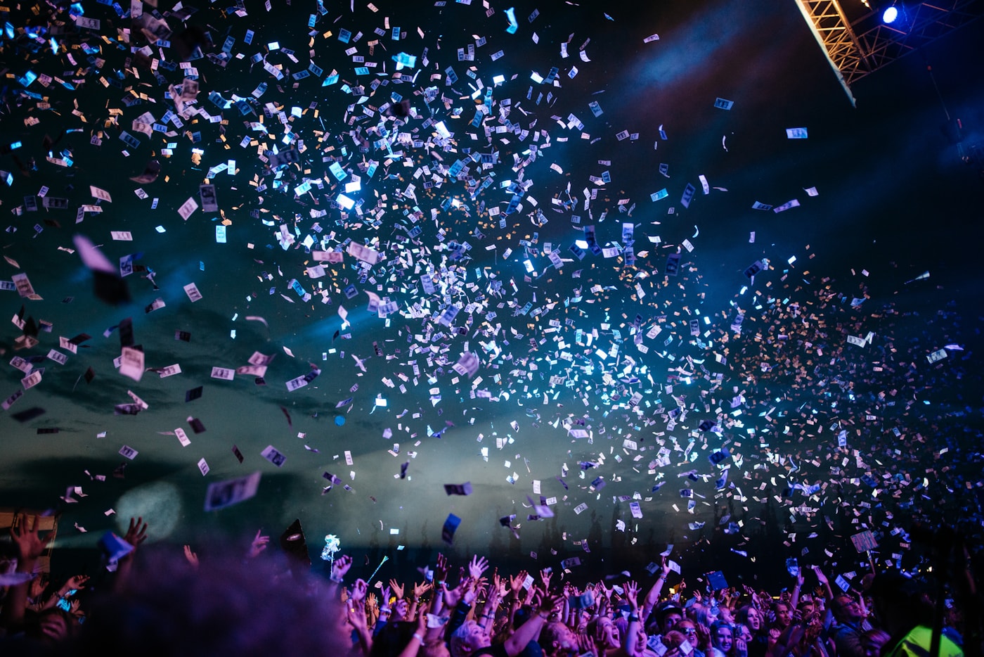 Confetti falling over a concert crowd